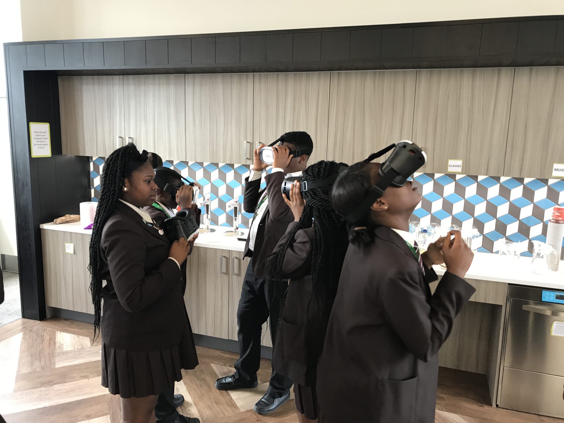Pupils wearing VR headsets