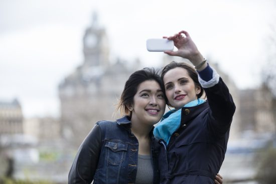 Two young women take a selfie in Edinburgh