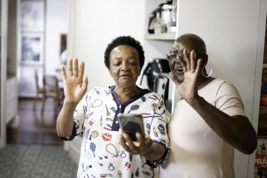 Elderly couple doing video call on smartphone