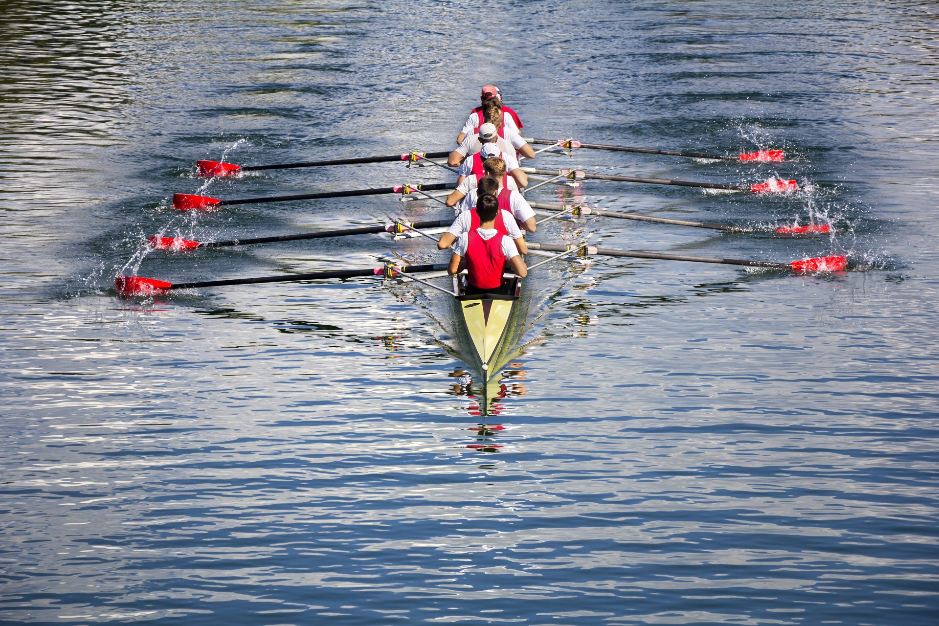 Rowing eight on lake