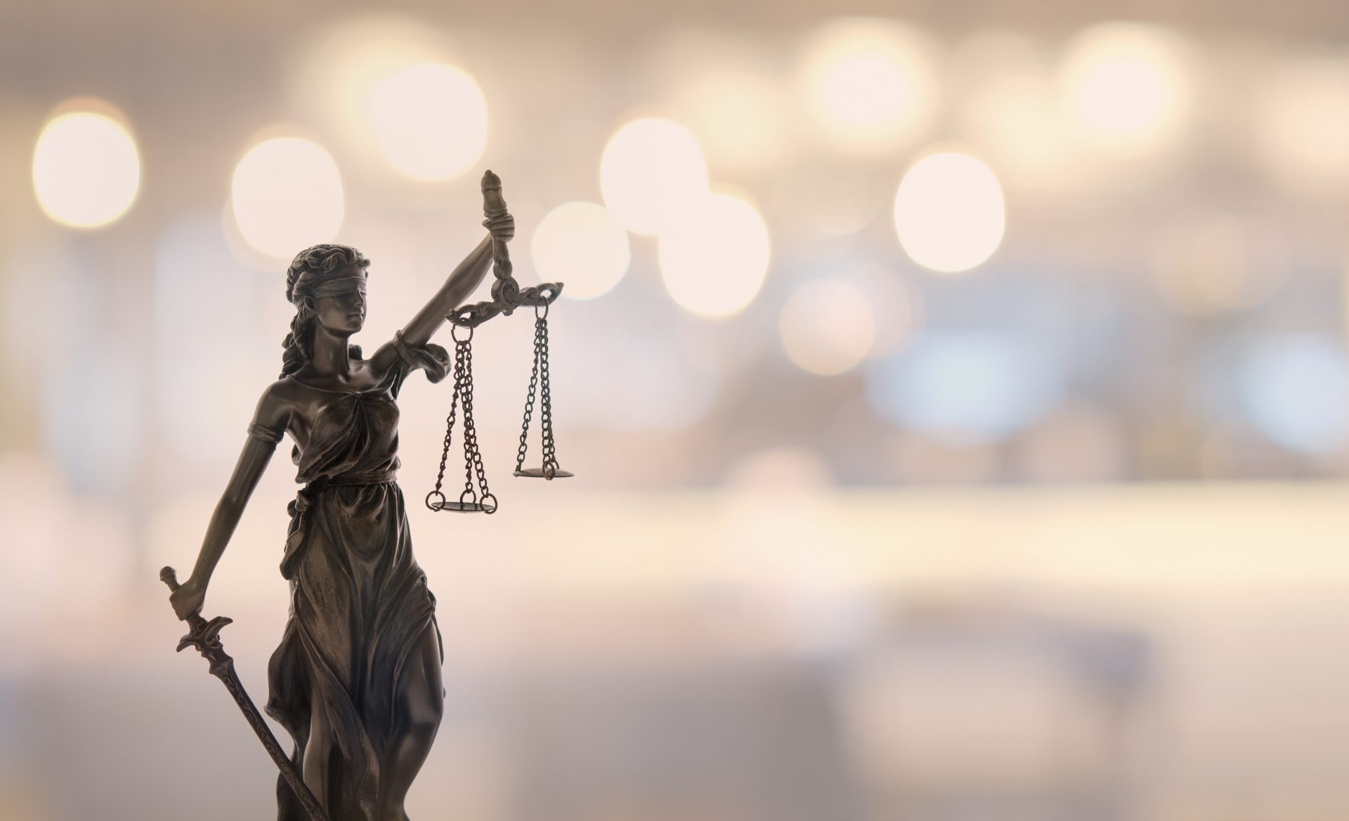 Statue of Justice against blurred background
