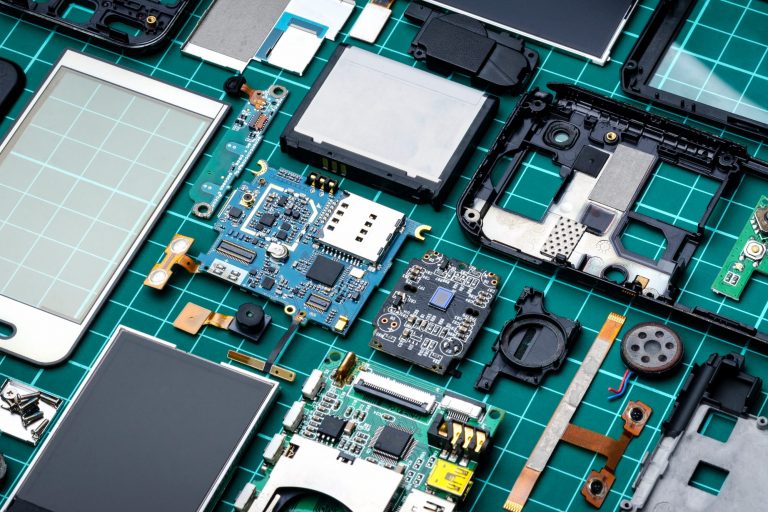 Smartphone components laid out on table