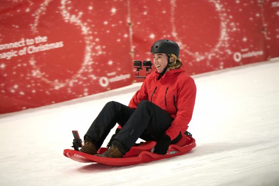 photo of Rory Dixon sledging on a specially-equipped Vodafone 5G bobsleigh.