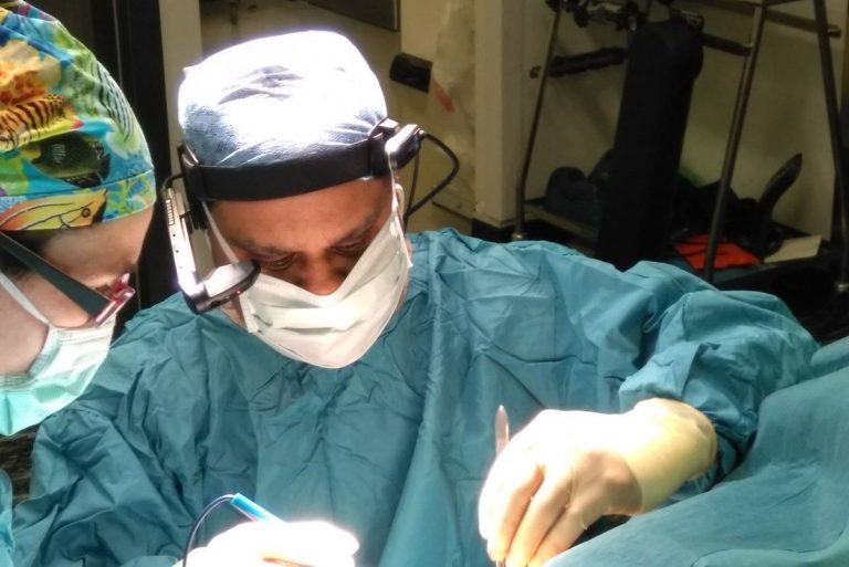 Prof Shafi Ahmed performing operation while wearing headset