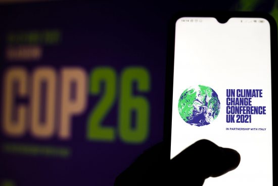 COP26 conference banner and smartphone app