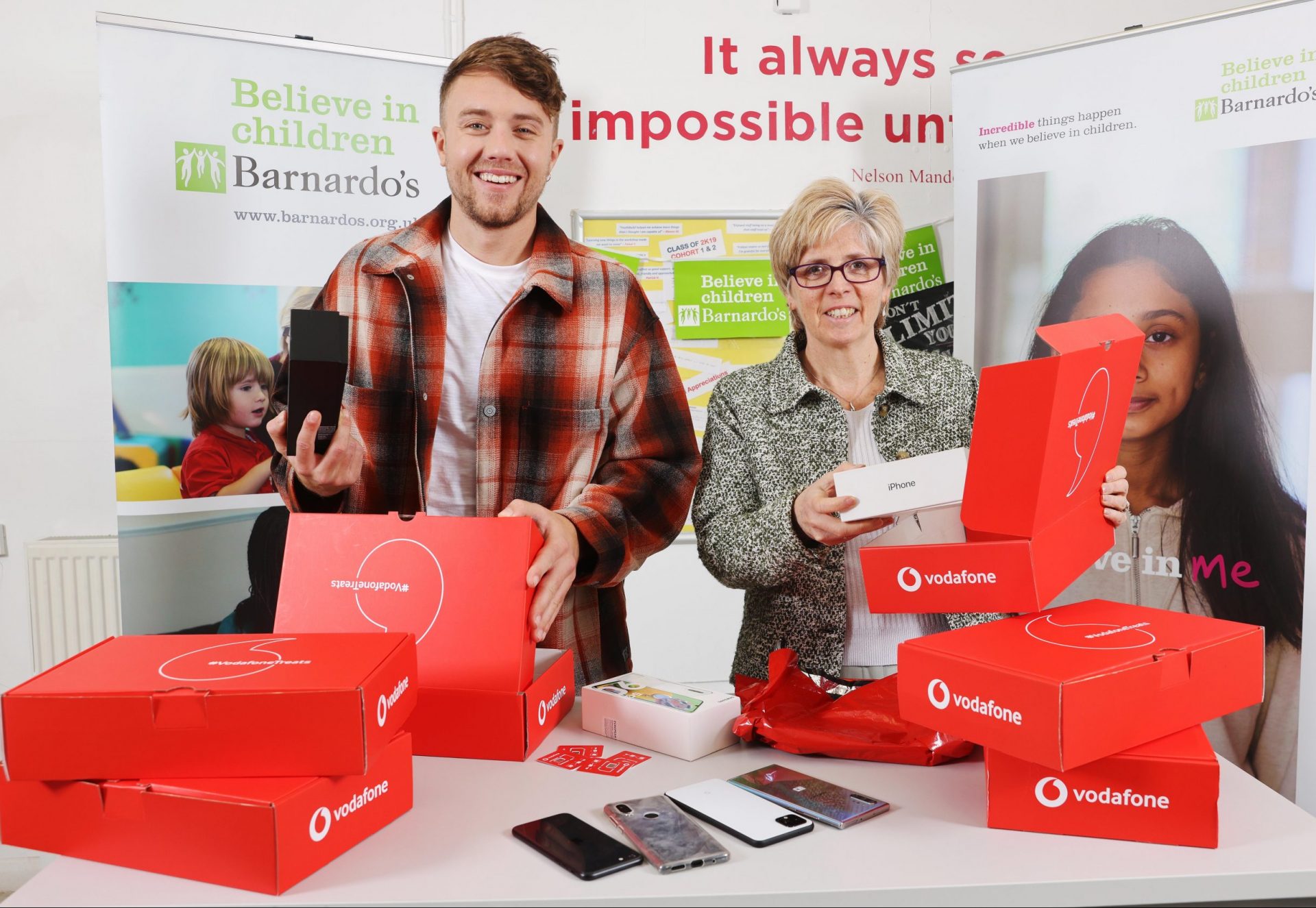 Broadcaster Roman Kemp and Lucy Ivankovic, Head of Children's Services London, Barnardo's reboxing pre-loved phones