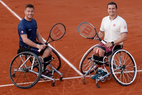 tennis players Alfie Hewett and Gordon Reid posing on court