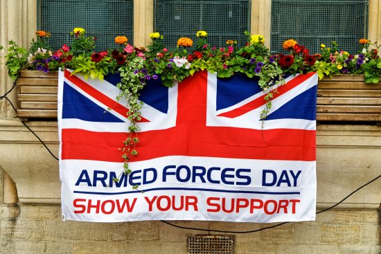 Armed Forces Day flag hanging from window boxes
