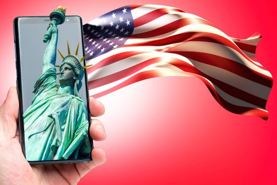 US flag and Statue of Liberty on smartphone graphic